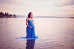 maternity photo shoot in lake washington Seattle. Mother standing in knee deep water